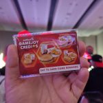 : "Close-up of a futuristic circuit board with glowing blue and orange lights.