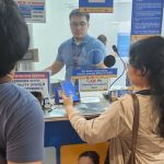 Close-up of a modern smartphone with a sleek metallic frame and vibrant display showcasing a colorful app interface.