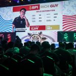 : "Close-up of a circuit board with glowing blue and orange electronic components.