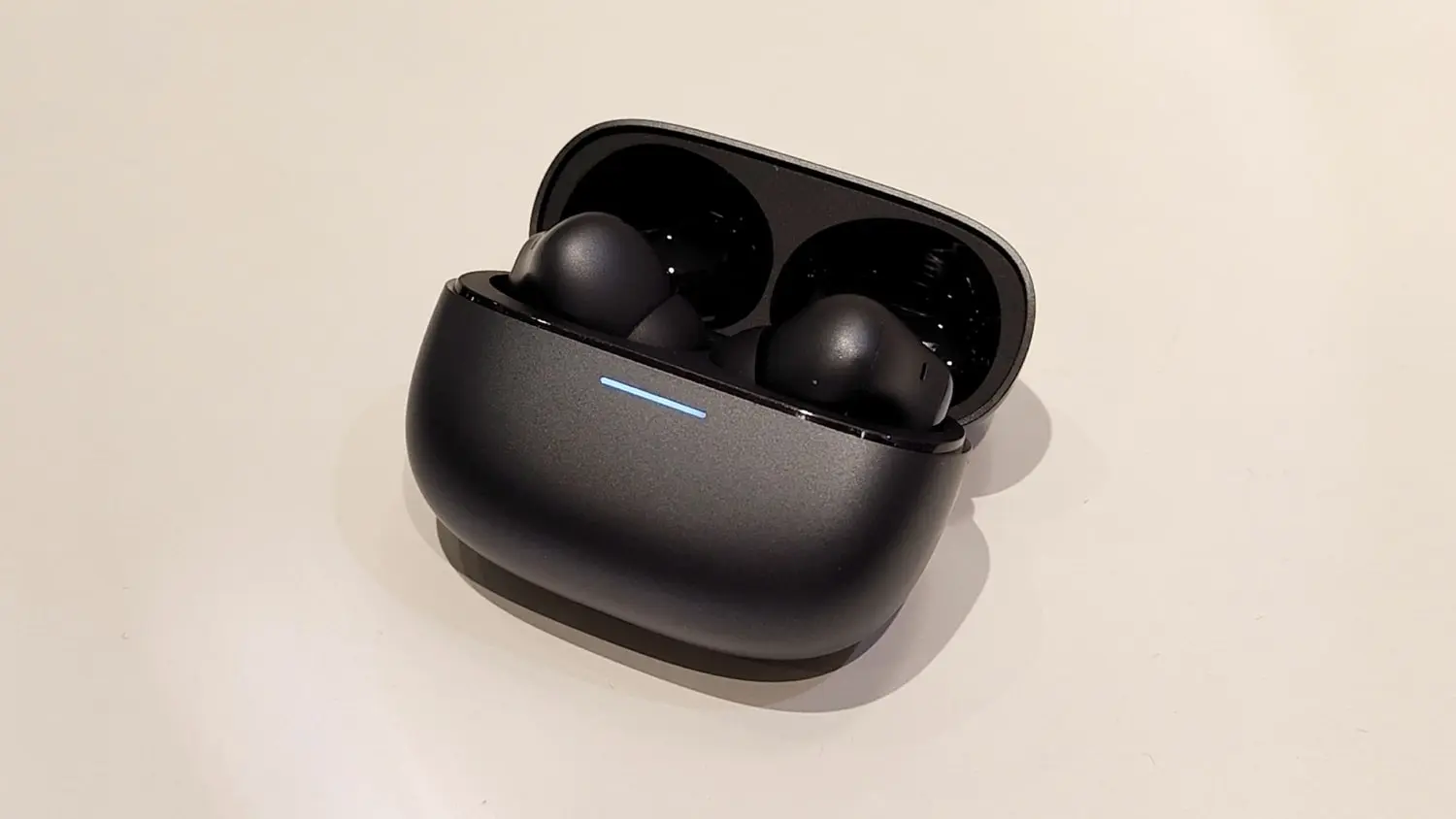 Redmi Buds 6 Pro wireless earbuds in sleek black with touch controls and ergonomic design for premium audio.